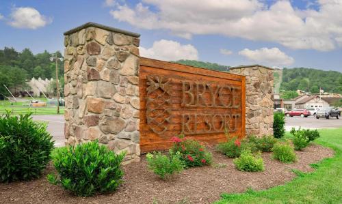 a stone building with a wooden gate in a yard at No Dog Fees - Dog Friendly 3BR 2BA with Loft and Mountain Views - Near Bryce Resort in Basye, VA in Basye