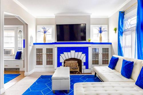 a living room with a fireplace and a tv at The Sapphire Haven - Your Old Brooklyn Oasis Awaits Families, Couples, Business Travelers Near Downtown With Parking, 300 MB WiFi & Self Check-In in Cleveland