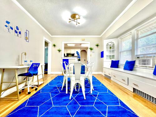 a dining room with blue carpet and blue chairs at The Sapphire Haven - Your Old Brooklyn Oasis Awaits Families, Couples, Business Travelers Near Downtown With Parking, 300 MB WiFi & Self Check-In in Cleveland