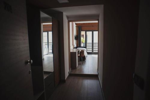 a hallway with a view of a room with a table at Il Vicoletto Bovalino - B&B in Bovalino Marina