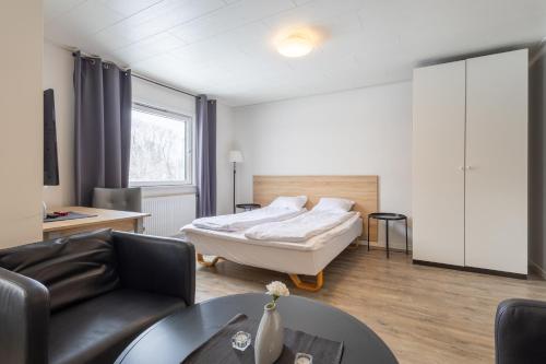 Postel nebo postele na pokoji v ubytování Halmstad Hotel Apartments