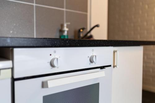 Kuchyň nebo kuchyňský kout v ubytování Halmstad Hotel Apartments