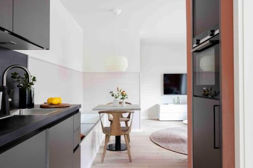 a kitchen with a small table in the middle of it at Bootsmann in Sankt Peter-Ording