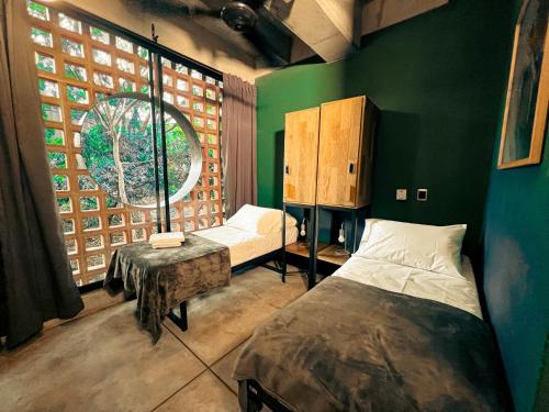 Postel nebo postele na pokoji v ubytování Viajero Medellín Hostel