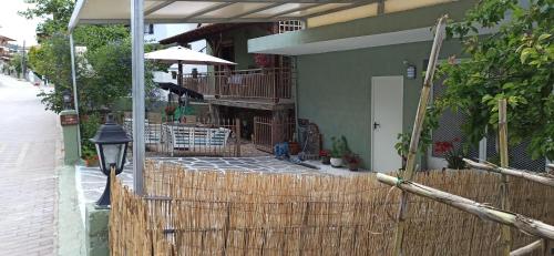 a wooden fence in front of a house at Blue Fairytale in Ayios Nikolaos Sithonia