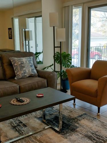 a living room with a couch and a coffee table at Welcome to Midtown Condo in Little Rock