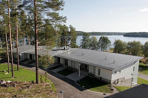 an overhead view of a house with a lake at Pajulahti Olympic & Paralympic Training Center in Nastola