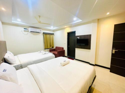 Deccan Suites, Tirupatiにあるベッド