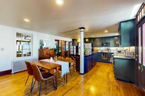 a kitchen with a table and chairs in a room at Belfast Victorian in Belfast