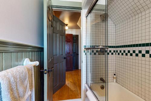 a bathroom with a shower and a tub and a sink at Belfast Victorian in Belfast