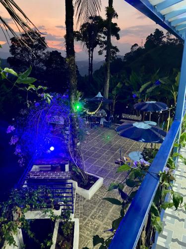 a view from the balcony of a resort at night at Vista Farallones Hostel in Jardin