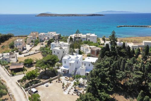 an aerial view of a white village next to the ocean at Kiki's dream apartment balcony with sea views in Chrissi Akti