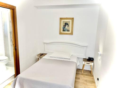 Una cama o camas en una habitación de Hotel S. Ercolano