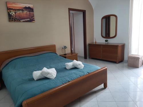 Postel nebo postele na pokoji v ubytování AUTENTICA NAPOLI HOME