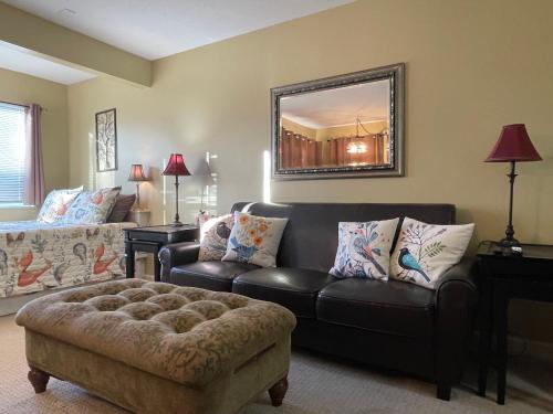 a living room with a couch and a chair at Gatlinburg Summit Getaway for 2 With Amazing View! in Gatlinburg