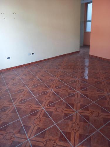 an empty room with a tiled floor at Alquiler de minidepartamento in Lima
