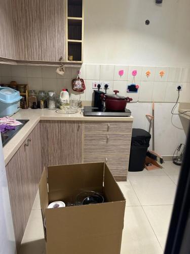 a cardboard box in the middle of a kitchen at Hash&Jazz in Manama