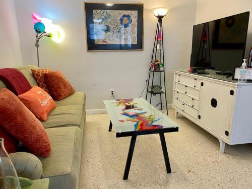 a living room with a couch and a coffee table at Funky Downtown Pad Pets OK Near Intercoastal in St. Augustine