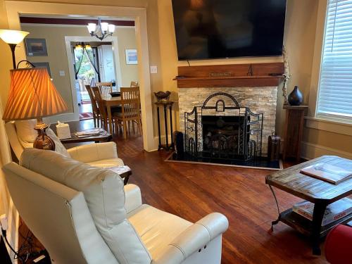 a living room with a couch and a fireplace at Kid and Pet friendly Downtown Home Walk Everywhere in Saint Augustine