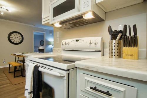 a kitchen with a stove and a counter top at Bungalow Bliss ※ Beach Cottage Blocks From Ocean in Myrtle Beach