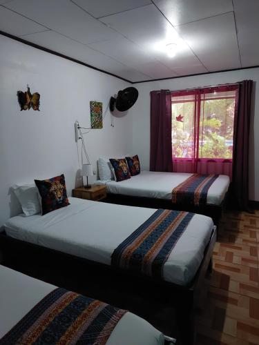 Postel nebo postele na pokoji v ubytování Chinitas Eco Lodge