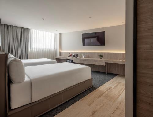 Cama o camas de una habitación en Hotel Elements by Marquis