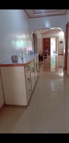 a kitchen with a sink and a counter top at Bon Joy Bed & Breakfast in Mabini
