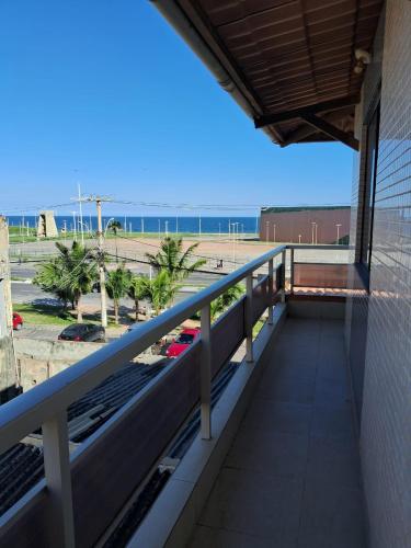a balcony of a building with a view of the beach at Aeroclube in Salvador