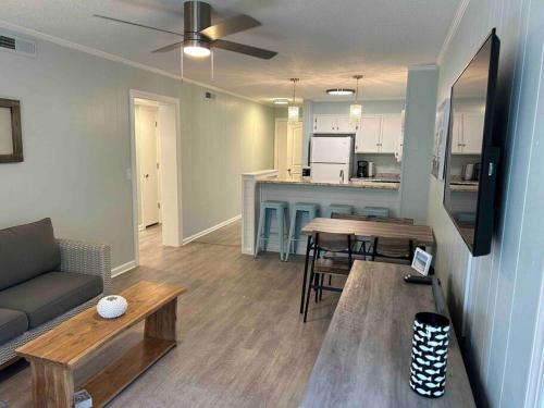 a living room with a couch and a table at Ocean Breeze Beachfront Condo, Newly Renovated in Myrtle Beach