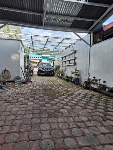 a car parked in a garage with a car parked at Umah Bapak in Takengon