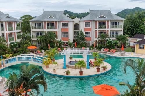 an aerial view of a resort with a pool at Premium Travel Escapes - Studio Apartment in Rodney Bay Village