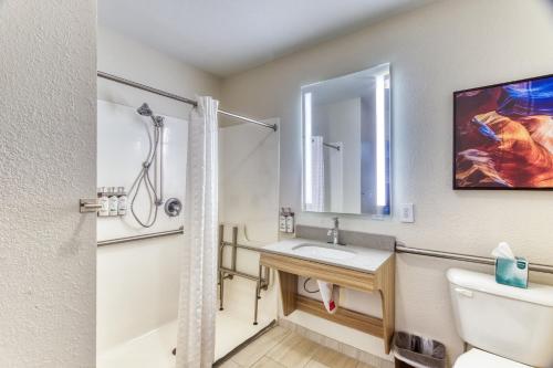 a bathroom with a sink and a toilet at Candlewood Suites New Bern by IHG in New Bern