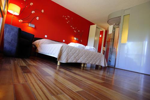 Cama o camas de una habitación en La Résidence du Spa et la Résidence des Thermes