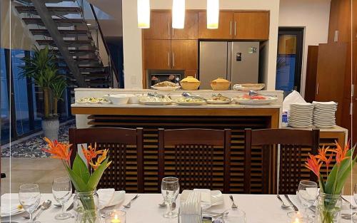 a restaurant with a table with plates of food at The Ocean Villas Managed by The Ocean Resort in Da Nang