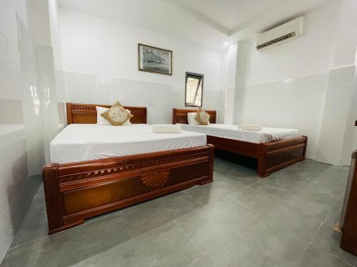 Giường trong phòng chung tại Cuong Thinh Homestay