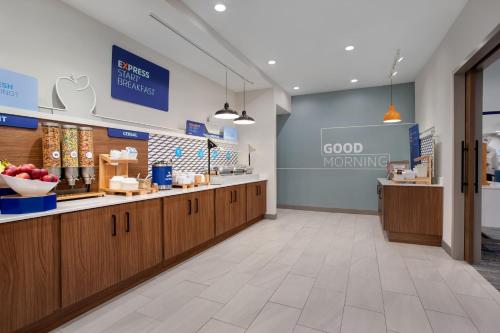 a store with a good working sign on the wall at Holiday Inn Express Hotel & Suites Terre Haute by IHG in Terre Haute