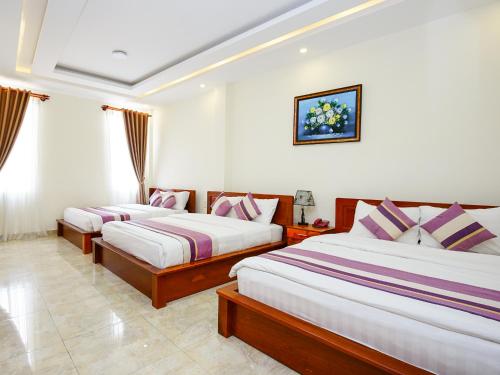 Voodi või voodid majutusasutuse Hoang Quan Hotel toas