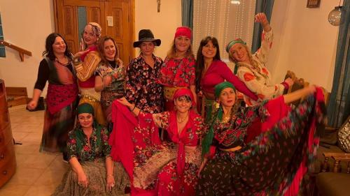 a group of women posing for a picture together at OLD SHEPHERD Guest House in Râșca