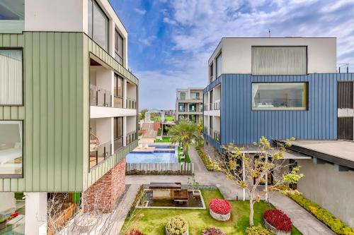 an aerial view of an apartment building with a pool at 寗夏時光 in Dongshan