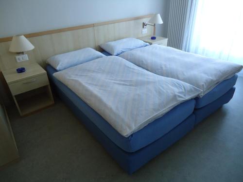 Ein Bett oder Betten in einem Zimmer der Unterkunft Osteria Belvedere