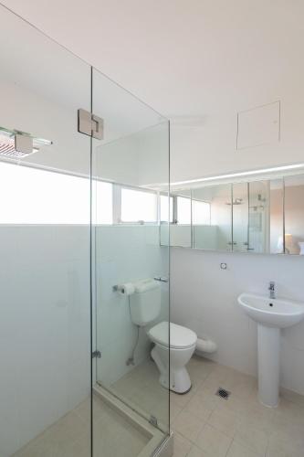 a bathroom with a toilet and a sink at The Gem-Executive Potts Point Harbourview Stunner in Sydney