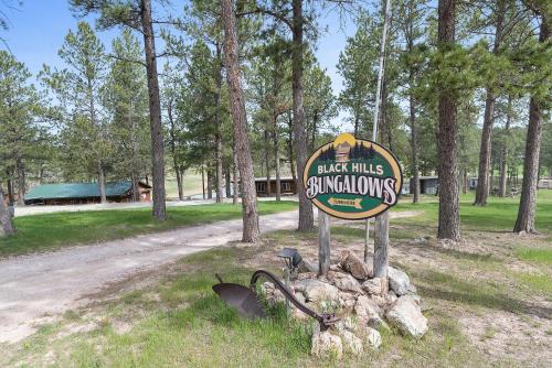 a sign for black hills snowmobils in a field at Modern Lodge- BHBungalows Main in Custer