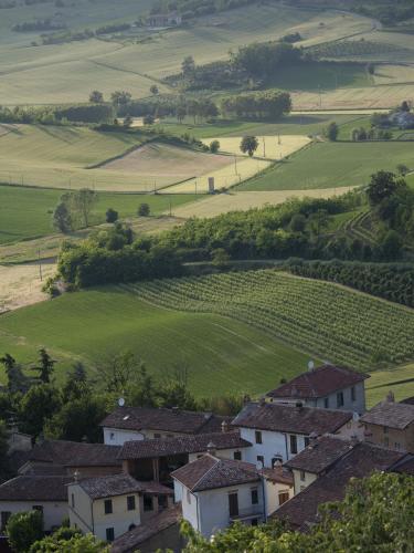 a village in the middle of a green field at Relais Palazzo Paleologi Sec.XIV in Lu