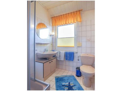 a bathroom with a sink and a toilet at Holiday home - Beckmann-Visser 3 in Borkum