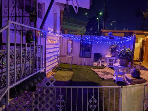 a house with purple lights on the front porch at Bunny's Bungalow in Las Vegas