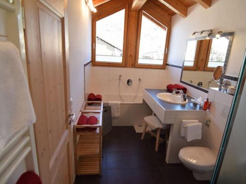 a bathroom with a sink and a tub and a toilet at Favorite place 2 in Garmisch-Partenkirchen