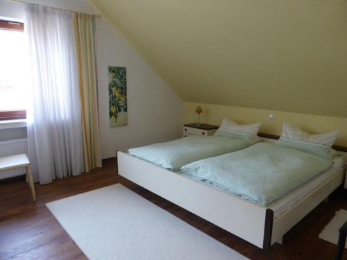 a bedroom with two beds in a room with a window at "Weserbergland" Modern retreat in Beverungen