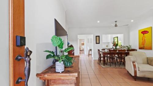 a room with a living room and a dining room at 51 Reef Street Port Douglas in Port Douglas