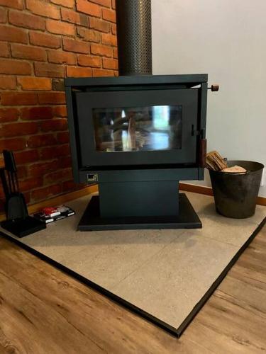 a television sitting on a floor in a living room at Close to Town and Very Private in Myrtleford