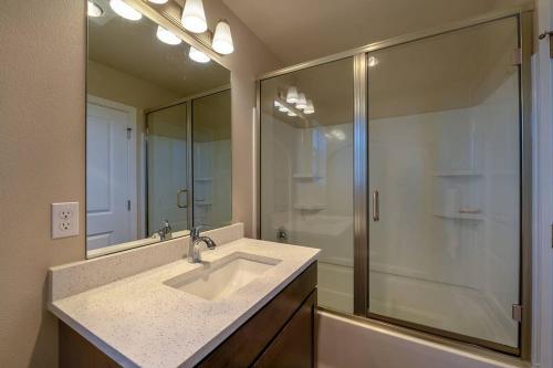 a bathroom with a sink and a shower at A-Seattle Urban Village- GU in Seattle